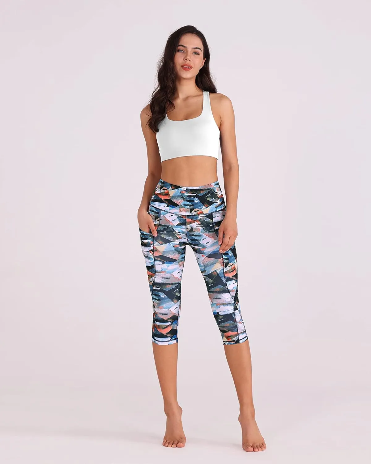 ODODOS Women's High Waisted Yoga Capris with Pockets, Tummy Control Non See Through Workout Athletic Running Capri Leggings