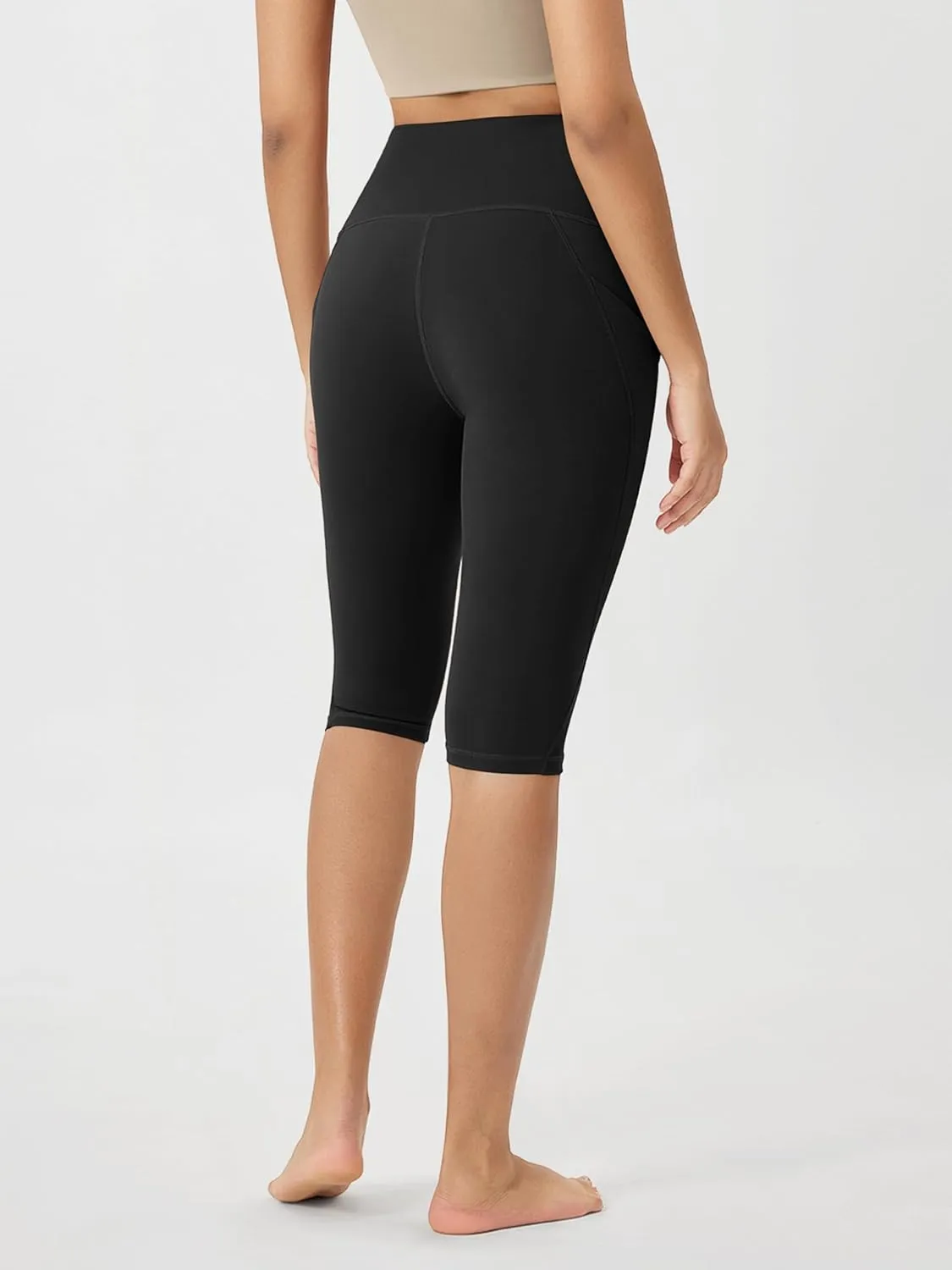 ODODOS Women's High Waisted Yoga Capris with Pockets, Tummy Control Non See Through Workout Athletic Running Capri Leggings