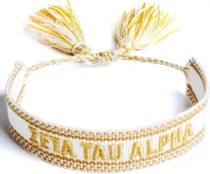Sorority Shop Zeta Tau Alpha Bracelet — Woven Bracelet, White and Gold Design with ZTA Sorority Name and Tassels, Greek Sorority Jewelry and Big Little Sorority Gifts